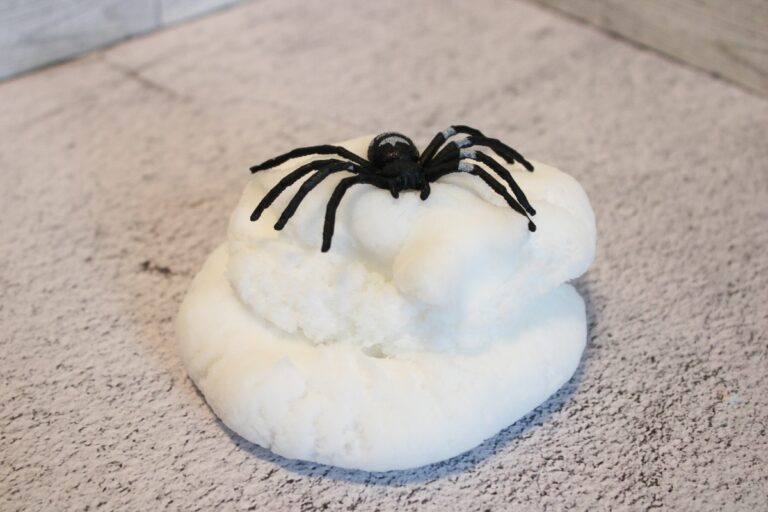 white slime with fake spider on top