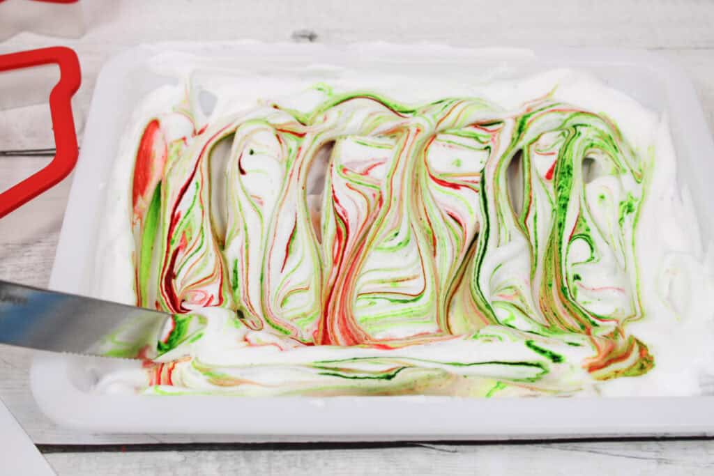 swirling shaving cream and food coloring